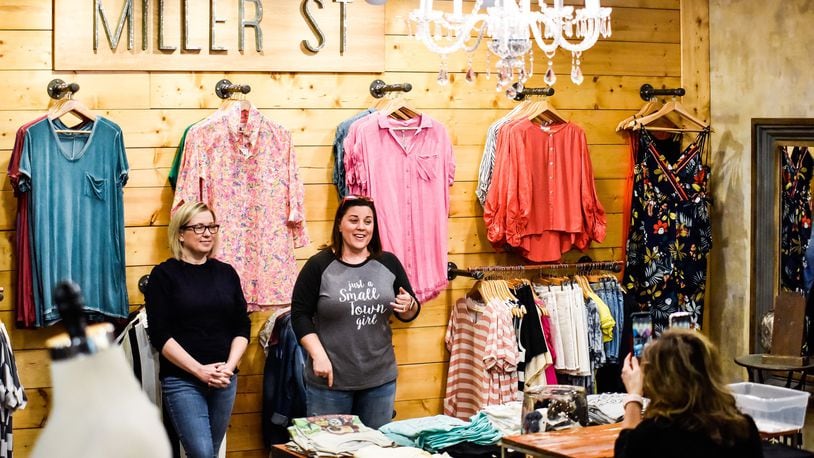 Tara Smithson, left, and Stephanie Gonya, co-owners of Miller St. Boutique on Nilles Road in Farifield, go live on Facebook and Instagram Monday, May 11, 2020 to talk about opening their retail shop to customers on Tuesday. They have increased their online presence since they have been closed almost two months due to the coronavirus pandemic. NICK GRAHAM / STAFF