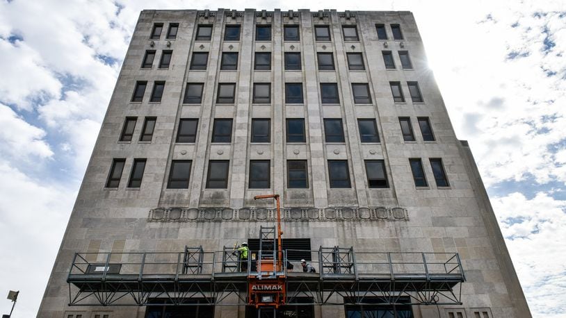 Crews were working on the exterior of the historic Goetz Tower Wednesday, March 13 in Middletown. Coon Restoration plans to transform the building into office and residential space that officials say will help that area of downtown. NICK GRAHAM/STAFF