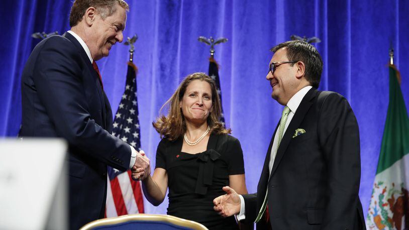 U.S. Trade Representative Robert Lighthizer, left, shakes hands with Canadian Foreign Affairs Minister Chrystia Freeland, accompanied by Mexico’s Secretary of Economy Ildefonso Guajardo Villarreal, after they spoke at a news conference, Wednesday, Aug. 16, 2017, at the start of NAFTA renegotiations in Washington. (AP Photo/Jacquelyn Martin)