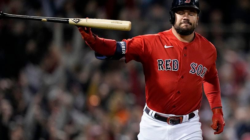 Boston Red Sox's Kyle Schwarber tosses his bat after a grand slam against the Houston Astros during the second inning in Game 3 of baseball's American League Championship Series last week in Boston. (AP Photo/David J. Phillip)