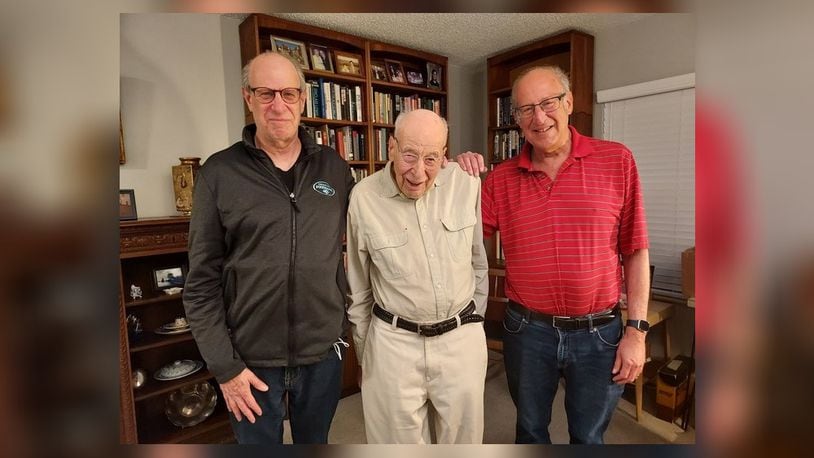 Dr. Al Miller, middle, pictured with his sons Randy Miller, left and Fred Miller, right, will speak at the Fitton Center for Creative Arts on Wed., Nov. 2, 2022. He will share his story of being a Holocaust survivor. GINNY MCCABE/CONTRIBUTED