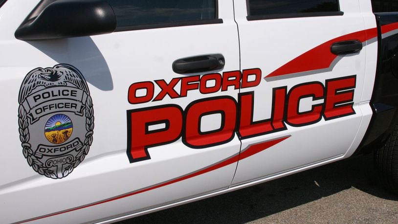 Brothers Michael and Jeff Fox were arrested and charged with assault, aggravated menacing and ethnic intimidation following an early-morning altercation on the south side of Oxford. FILE