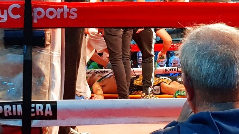Argentine boxer Hugo Santillan is placed on a stretcher after he collapsed at the end of a WBC title fight against Uruguay's Eduardo Abreu in San Nicolas, Argentina. Santillan died Thursday, July 25, from head trauma suffered during the fight.