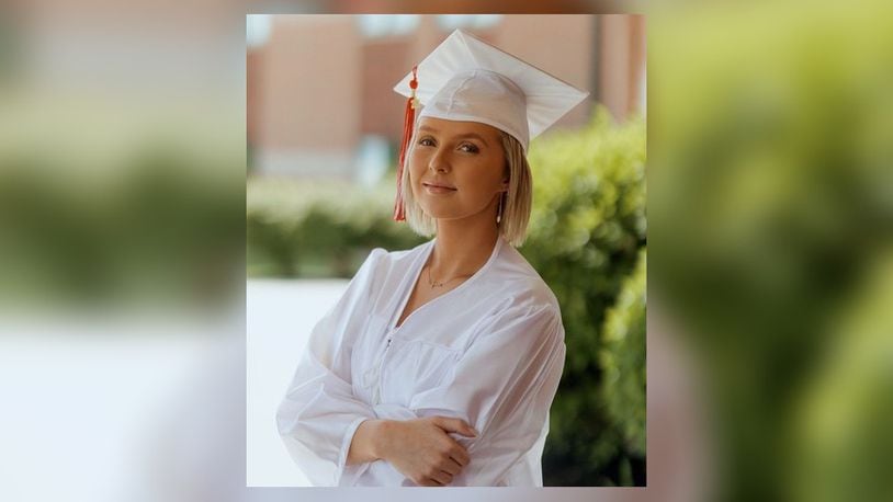 After extensive chemotherapy Mattie Cole now has a Madison High School diploma in her hand as she approaches the two-year anniversary of her last treatment. She plans to study radiology at  Sinclair Community College. CONTRIBUTED BY KATIE POFF PHOTOGRAPHY