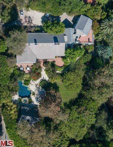 Property includes Mediterranean-style home, lagoon pool