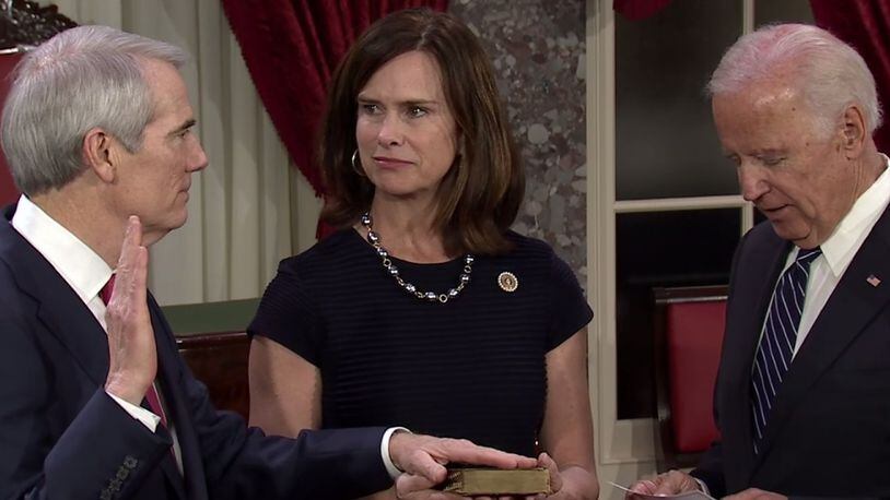U.S. Sen. Rob Portman, R-Ohio, is sworn in by Vice President Joe Biden. Portman’s wife, Jane is holding the Bible.