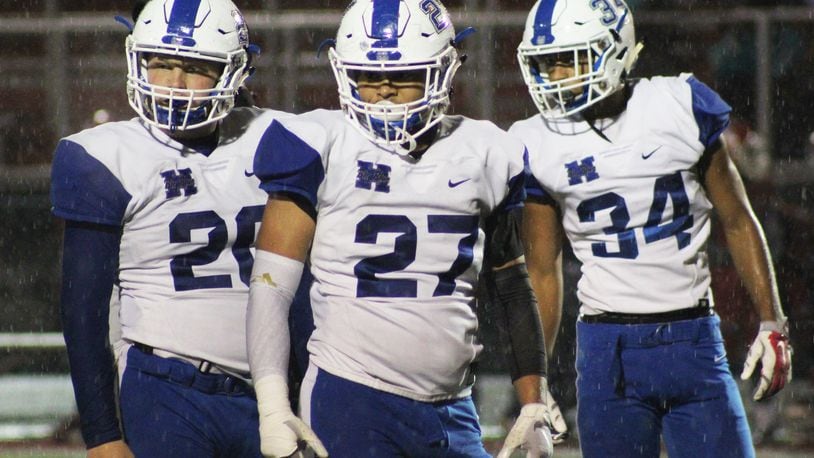 Hamilton’s Elijah Spradling (20), Jordan Jones (27) and Maleek Kaiser (34) look for a signal during Friday night’s 21-20 loss to Princeton in Sharonville. CONTRIBUTED PHOTO BY ISAIAH MILLER