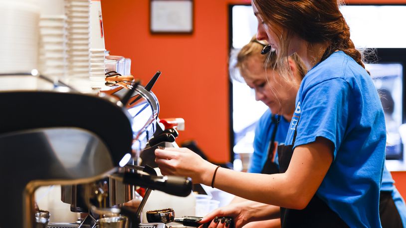 Brooklyn Oryan prepares a drink at the new Biggby Coffee location at 9433 Cincinnati Columbus Road in West Chester Township. NICK GRAHAM/STAFF