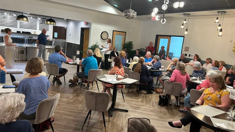 About 75 people packed the Central Connections cafeteria Tuesday morning to discuss their concerns about the future of the center with Executive Director Diane Rodgers and Board President Rick Fishbaugh. RICK McCRABB/STAFF