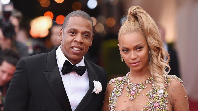 Jay Z (L) and Beyonce have a combined net worth of over $1 billion, according to Forbes. (Photo by Mike Coppola/Getty Images)