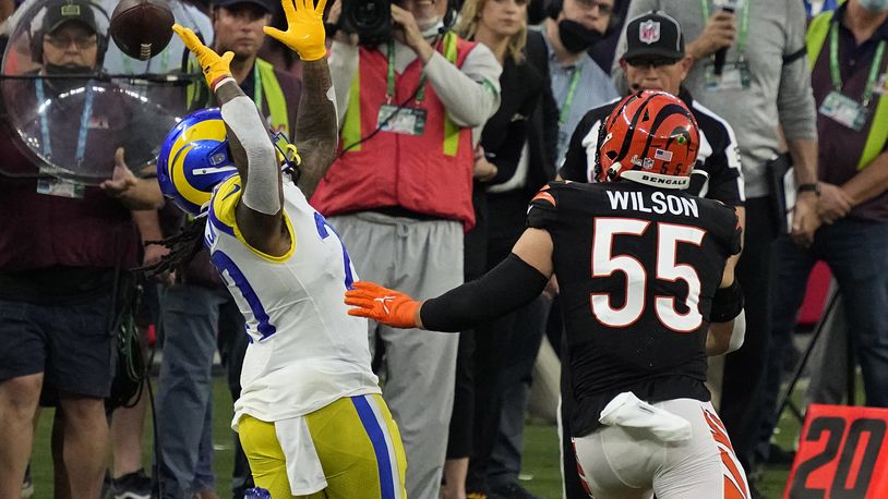 Los Angeles Rams running back Darrell Henderson Jr. (27) misses the catch against Cincinnati Bengals inside linebacker Logan Wilson (55) during the first half of the NFL Super Bowl 56 football game Sunday, Feb. 13, 2022, in Inglewood, Calif. (AP Photo/Julio Cortez)