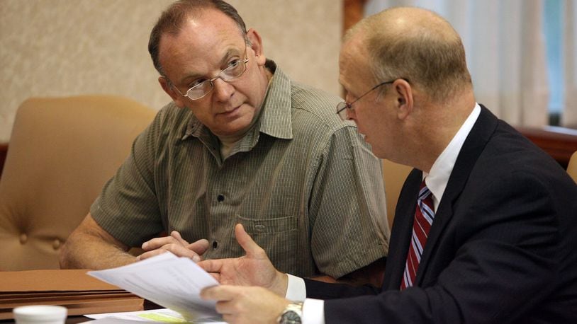 Raymond Tanner, talks with his attorney Greg Howard, who is now a Butler County Common Pleas judge, during a hearing Friday, Sept. 25, 2009, where he was ordered to remain under court control by Butler County Common Pleas Judge Andrew Nastoff. Tanner was found not guilty by reason of insanity after decapitating his wife on Valentine s day in 1990. FILE