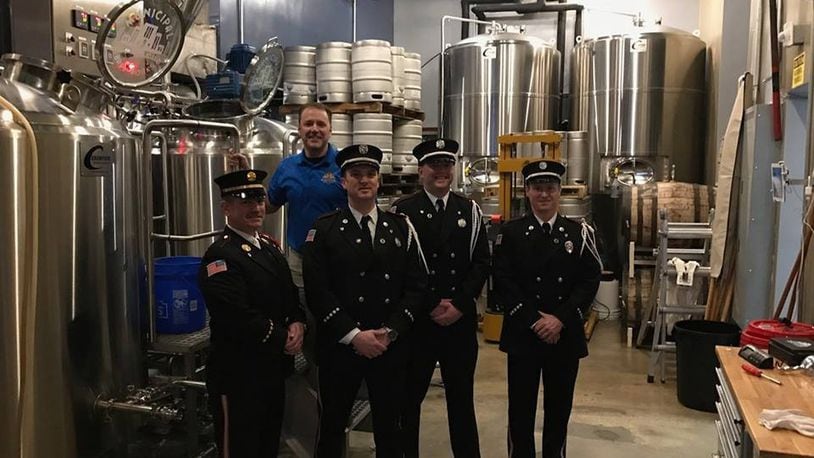 Members of the Hamilton Honor Guard unit received a check for $500 from the Municipal Brew Works. The brewery pledged money to the guard from proceeds from its Station 2 Rye Pale Ale. Brewery co-owner Jim Goodman presented the check.