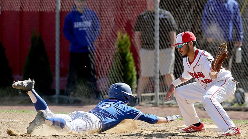 Hamilton’s Payton Pennington beats the pickoff attempt of Fairfield first baseman Trinidad Selvie during their game at Joe Nuxhall Field in Fairfield on May 7. CONTRIBUTED PHOTO BY E.L. HUBBARD