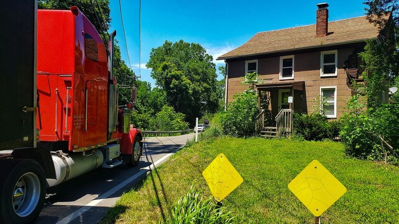The State of Ohio has purchased a house that sits just a few feet off of OH 122 between Beverly Lane and Hursh Road in Madison Township and plans to demolish the house to improve visibility in the area. NICK GRAHAM / STAFF