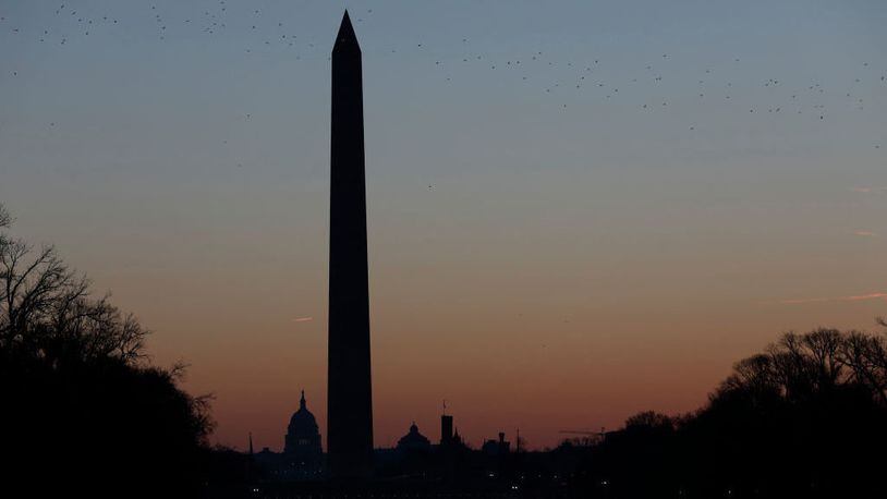 The Washington Monument at sunrise in Washington, DC. The popular tourist destination just reopened after a 3-year, $15 million renovation.