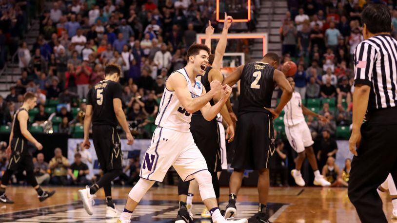 SALT LAKE CITY, UT - MARCH 16:  Bryant McIntosh #30 of the Northwestern Wildcats celebrates with teammates after defeating the Vanderbilt Commodores during the first round of the 2017 NCAA Men's Basketball Tournament at Vivint Smart Home Arena on March 16, 2017 in Salt Lake City, Utah.  (Photo by Christian Petersen/Getty Images)