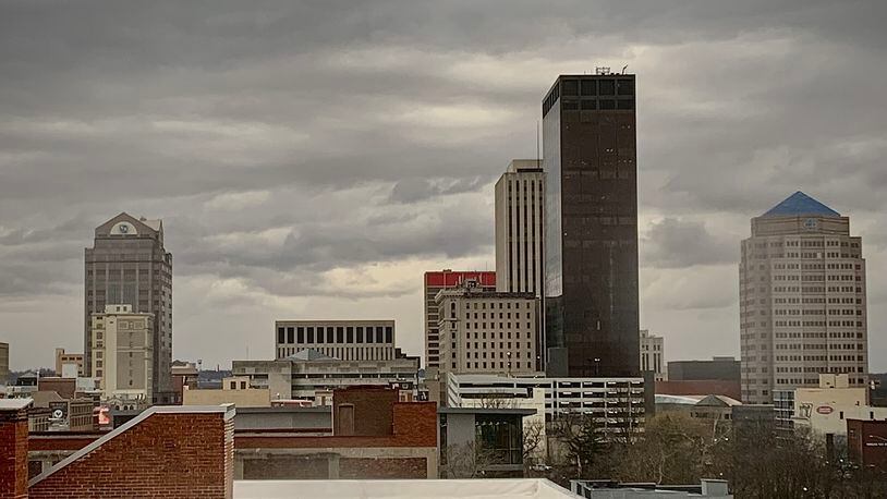 Dark clouds loom over downtown Dayton on Thursday, Jan. 19, 2023. MARSHALL GORBY/STAFF
