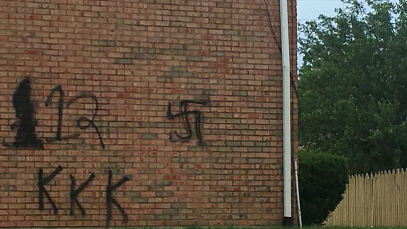 Someone this week spray painted KKK and swastika signs on the side of a condo in Trenton. RICK MCCRABB/STAFF