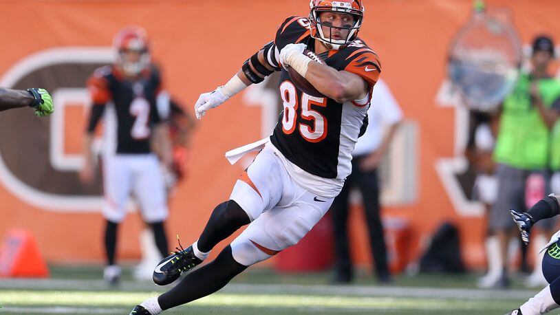 CINCINNATI, OH - OCTOBER 11: Tyler Eifert #85 of the Cincinnati Bengals runs after catching a pass during overtime against the Seattle Seahawks at Paul Brown Stadium on October 11, 2015 in Cincinnati, Ohio. Cincinnati defeated Seattle 27-24 in overtime. (Photo by Andy Lyons/Getty Images)