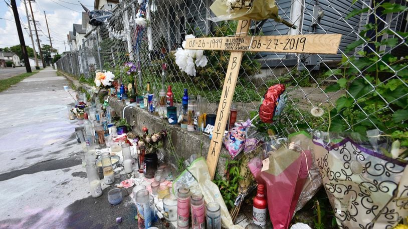 The memorial on East Avenue for Shon Walker, who was shot and killed July 2 has grown. NICK GRAHAM/STAFF