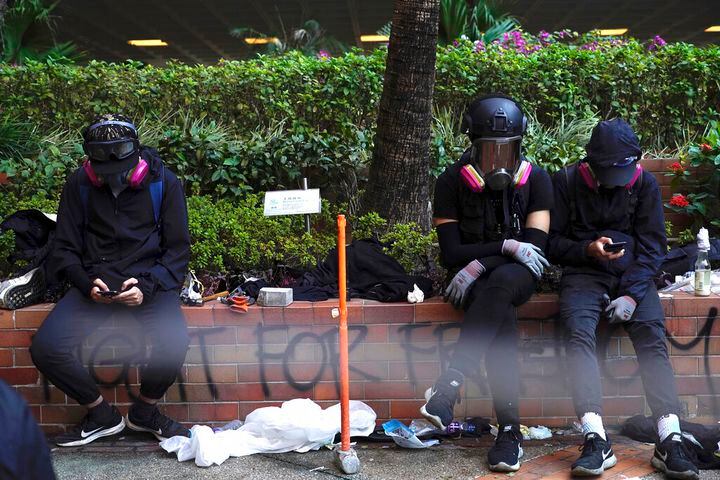 Photos: Police use tear gas to drive back protesters barricaded in Hong Kong university