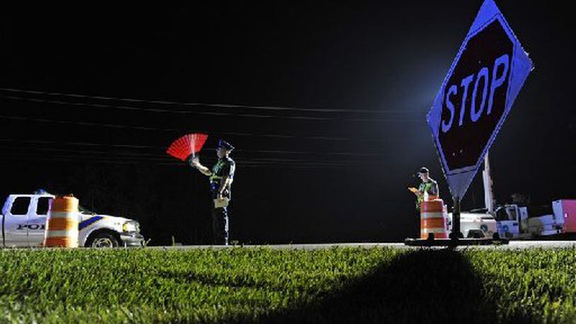 An OVI checkpoint, similar to this one, was held Friday night in Fairfield and resulted in no arrests. But two drivers were charged with OVI by police officers who saturated the area near the checkpoint. FILE PHOTO