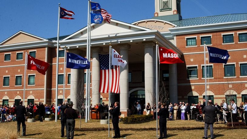 City and township flags are raised outside the Warren County Administration Building. FILE PHOTO