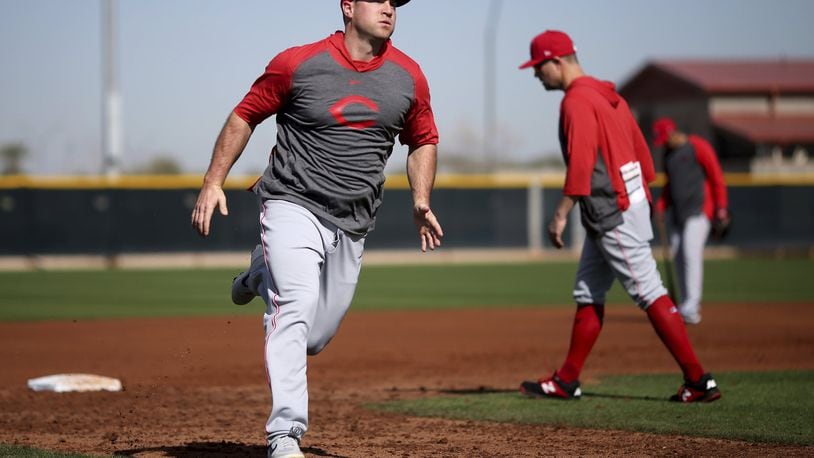 Cincinnati Reds right fielder Scott Schebler runs the bases during baseball spring training Wednesday, Feb. 19, 2020, in Goodyear, Ariz. (Kareem Elgazzar/The Cincinnati Enquirer via AP)