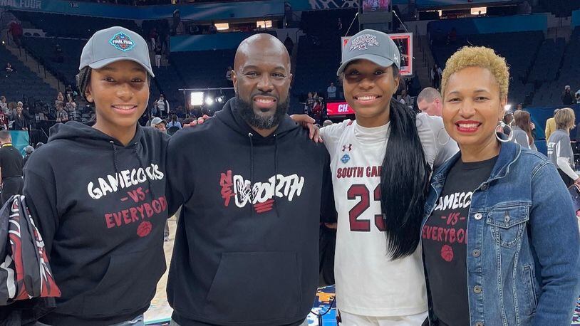 Bree Hall, second from right, is pictured with her sister Brooklyn, left, and parents Bryan and LaShauna after South Carolina's NCAA championship victory against Connecticut on Sunday, April 3, 2022, in Minneapolis, Minn. Photo courtesy of the Hall family
