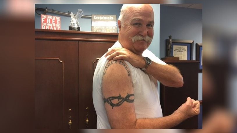 Butler County Sheriff Richard Jones shows two of four tattoos he received in the past three years. LAUREN PACK/STAFF