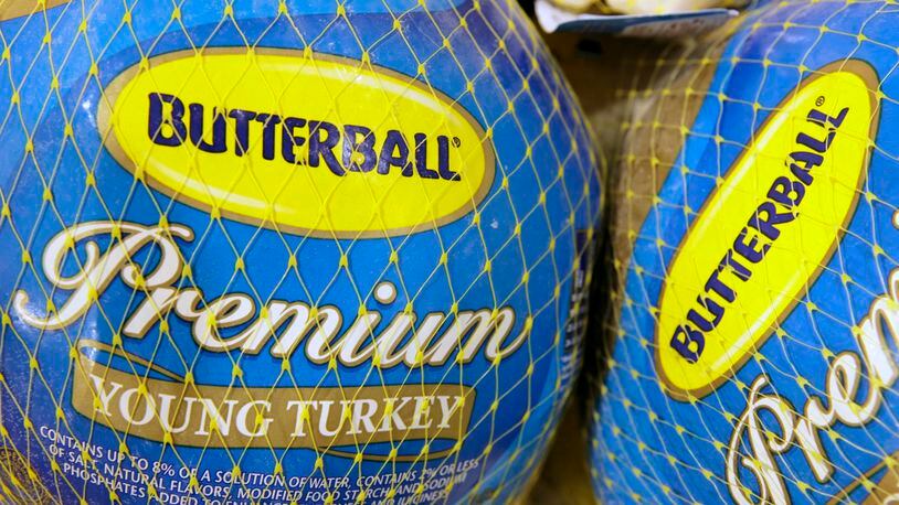 FILE - In this file photo made Dec. 7, 2009, Butterball frozen turkeys are on display at Heinen's grocery store in Bainbridge Township, Ohio. Butterball, which has been fielding phone calls from Thanksgiving cooks for more than 35 years, is letting people text their turkey-related questions this year for the first time. The company’s regular phone help line begins Tuesday, Nov. 1, 2016. Butterball will start take text message questions on Nov. 17, 2016, and continue through Thanksgiving Day. (AP Photo/Amy Sancetta, File)