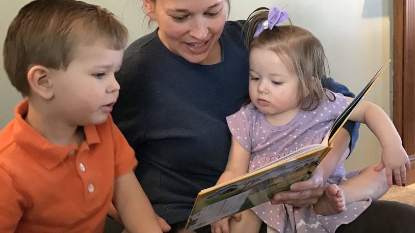 Brenda Herring says she typically reads to her two younger children, Bryson, 3, and Rylee, 14 months, twice a day. Introducing her four children to reading will help them in school and the rest of their lives, she believes.