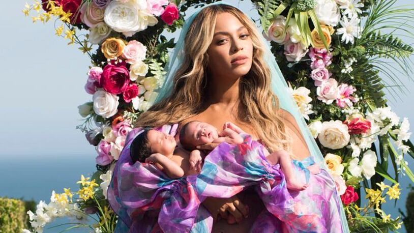In this undated image released by Parkwood Entertainment on Friday, July 14, 2017, Beyonce posed with her newborn twins Sir Carter and Rumi. (Mason Poole/Parkwood Entertainment via AP)