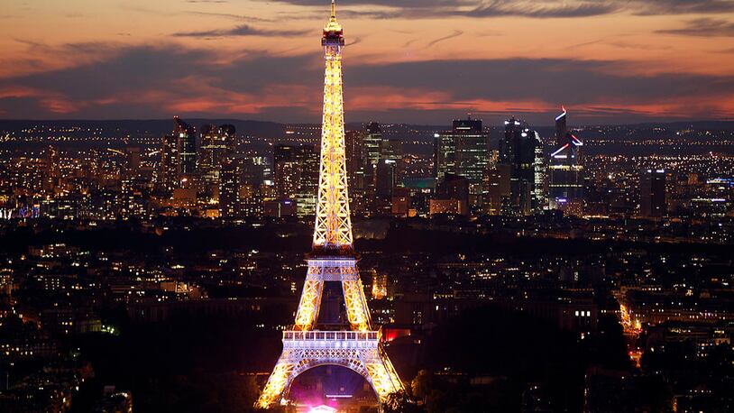 The Eiffel Tower is shown lit up in Paris, France. (Photo by Thierry Chesnot/Getty Images)