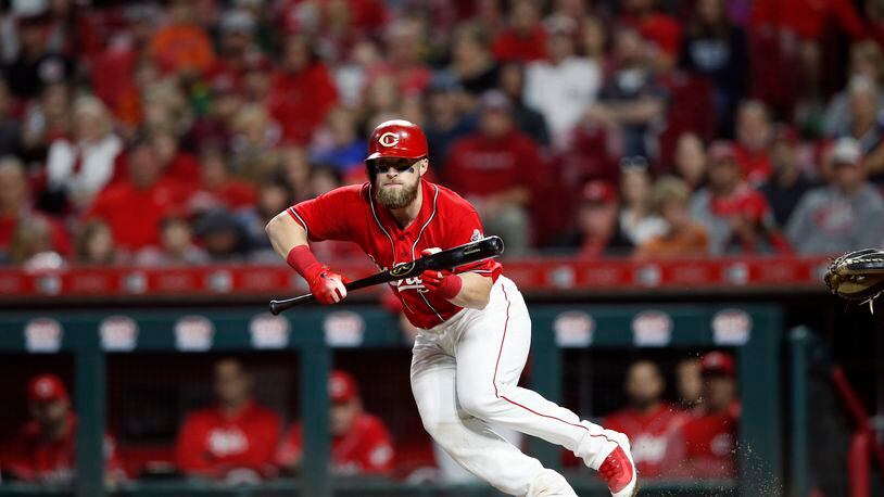 CINCINNATI, OH - SEPTEMBER 28: Tucker Barnhart #16 of the Cincinnati Reds bunts for a single in the seventh inning against the Pittsburgh Pirates at Great American Ball Park on September 28, 2018 in Cincinnati, Ohio. The Pirates won 8-4. (Photo by Joe Robbins/Getty Images)