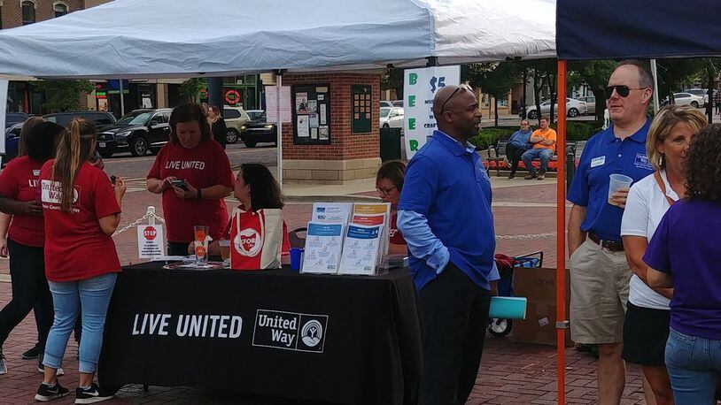 Butler County United Way staff and volunteers were in Oxford June 26 for the kickoff Uptown to meet local residents and talk about the organization into which the United Way of Oxford, Ohio and Vicinity merged Feb. 1. CONTRIBUTED/BOB RATTERMAN