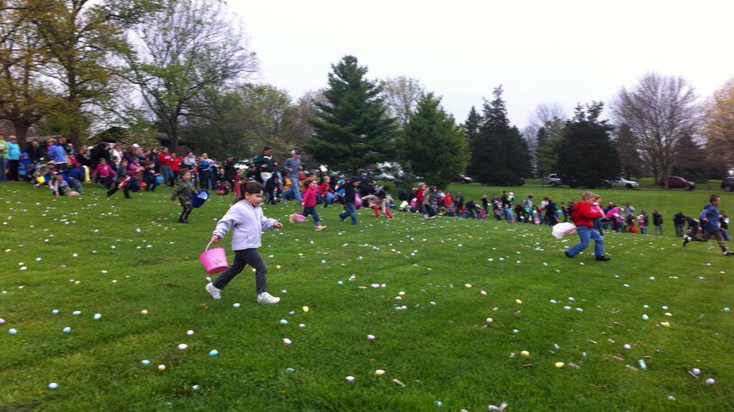 Children scour for candy during Fairfield’s annual Hoppin’ at Harbin Easter egg hunt at Harbin Park in 2012. CONTRIBUTED