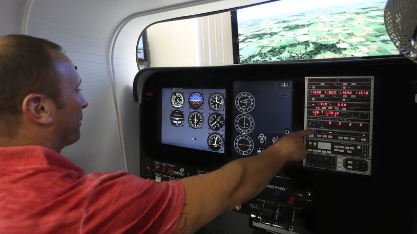 Douglas Carbone, 44, a student in the helicopter track of the aeronautical science program, during a flight simulator training session at Palm Beach State College June 09, 2015, in Lake Worth. (Bill Ingram / Palm Beach Post)