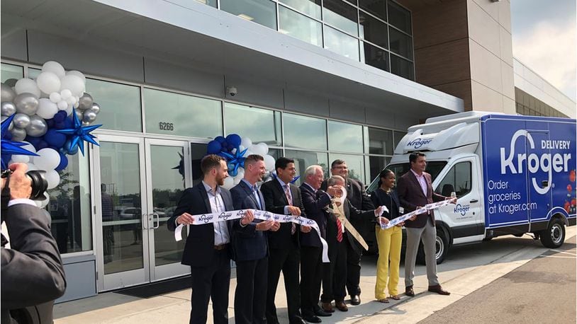 Gov. Mike DeWine and others on Friday cut a ribbon to ceremonially open the Kroger online distribution facility that began operating in March and already has delivered to more than 30,000 customers. MIKE RUTLEDGE/STAFF