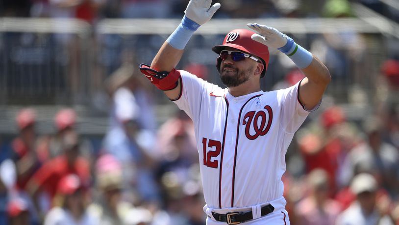 Washington Nationals' Kyle Schwarber celebrates his home run during the fifth inning of a baseball game against the New York Mets, Sunday, June 20, 2021, in Washington. (AP Photo/Nick Wass)