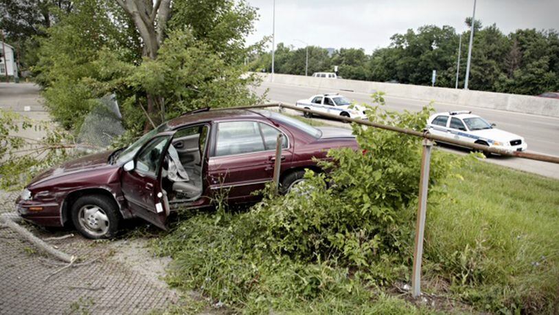 Counterfeit paper currency was found in this car, which crashed through a fence off U.S. 35 on Thursday, Aug. 1, 2013. (Jim Noelker/Staff)
