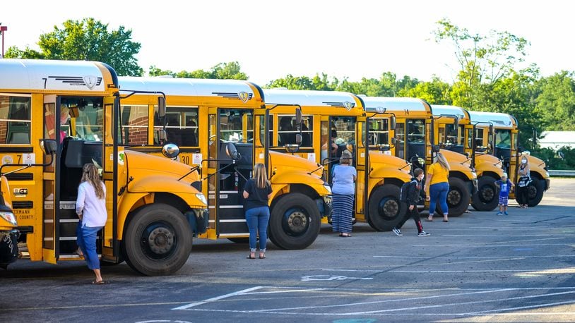 The Ohio Supreme Court has cleared the way for staff to carry concealed weapons, pending the appeal. Students wear face masks as they arrive on buses at Madison Elementary School Thursday, August 20, 2020 in Madison Township. NICK GRAHAM / STAFF