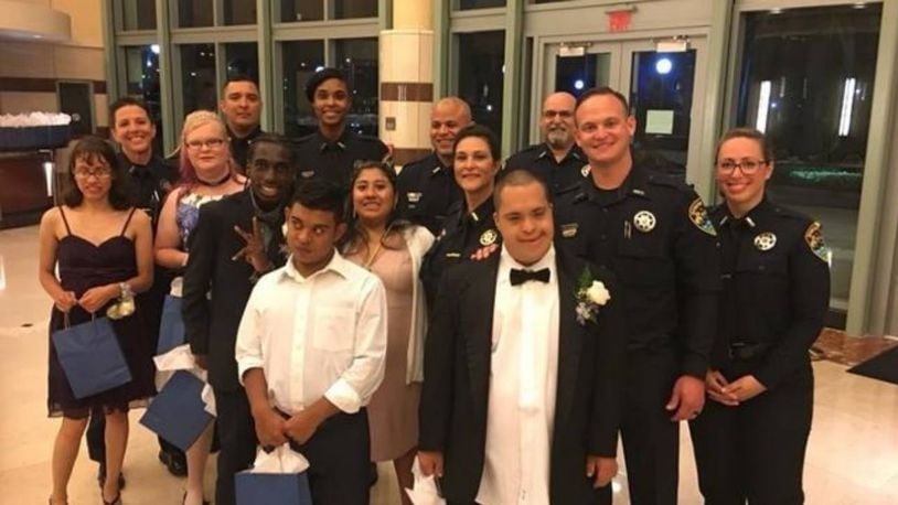 Officers from the Boynton Beach Police Department posed with their dates before Saturday night's prom.