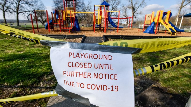 The playgrounds at Smith Park in Middletown has caution tape and signs indicating it is closed due to COVID-19. Many playgrounds in Butler County are off limits as a precaution against the spread of coronavirus. NICK GRAHAM/STAFF