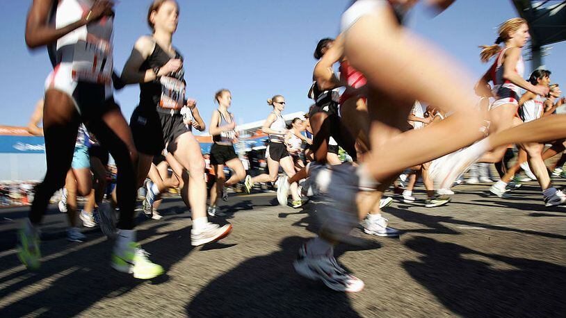 Runners stream over the Verrazano Narrows Bridge at the start of the 2004 New York City Marathon.