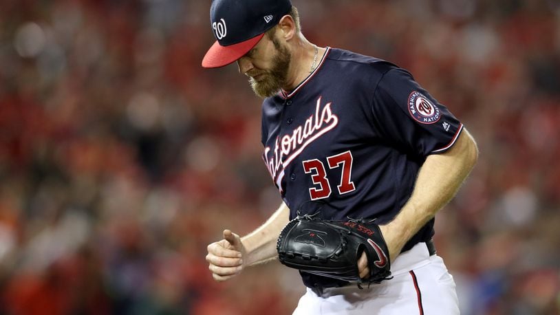 WASHINGTON, DC - OCTOBER 14: Stephen Strasburg #37 of the Washington Nationals runs off the mound after retiring his side in the third inning during game three of the National League Championship Series against the St. Louis Cardinals at Nationals Park on October 14, 2019 in Washington, DC. (Photo by Rob Carr/Getty Images)