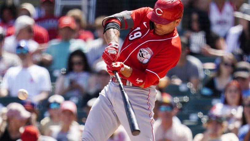 Cincinnati Reds' Joey Votto connects for an RBI double against the Arizona Diamondbacks during the second inning of a spring training baseball game Sunday, April 3, 2022, in Scottsdale, Ariz. (AP Photo/Ross D. Franklin)