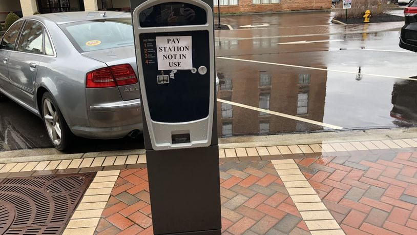 Hamilton parking kiosks were to be activated to begin collecting money in March of 2020, but that was delayed by the Covid-19 pandemic. The kiosks will be activated July 12. In the meantime, parkers are receiving warning slips about the need to pay in the near future. MIKE RUTLEDGE/STAFF
