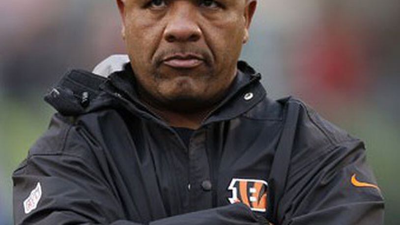 Sunday, Nov. 17, 2013 BENGALS SPORTS : Cincinnati Bengals running backs coach Hue Jackson watches his guys warm up prior to their game against the Cleveland Browns at Paul Brown Stadium. The Enquirer/Jeff Swinger
